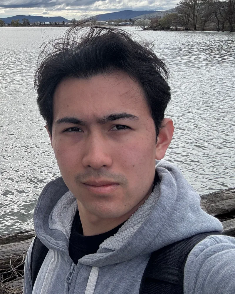 Daniel, Technician Assistant at PC Repair Center, beside a lake